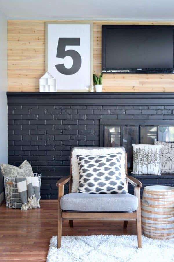 living room chair with black fireplace